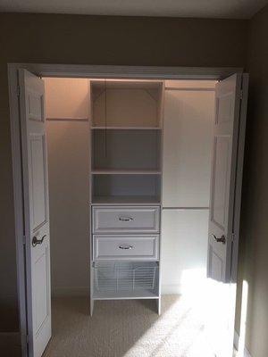 Freshly painted closet with organizer.