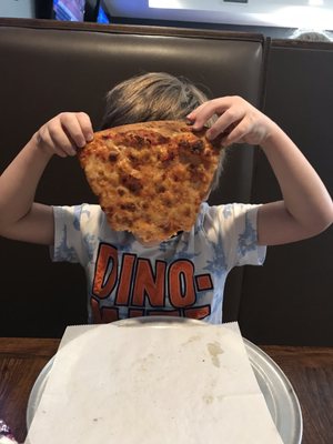 Pizza as big as his head.