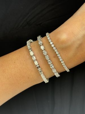 The natural diamond tennis bracelets I tried on. We couldn't decide because we loved them all, but I went with the middle one!