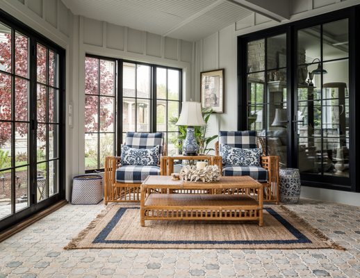 Sun room perfection. Concrete tiles by ARTO, paneled walls and timeless accents make for the perfect place to cozy up!