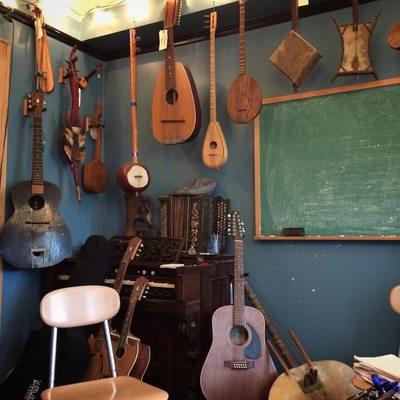 One of the many instrument lined classrooms at the school- a massive array of vintage strings that were donated from a collector.