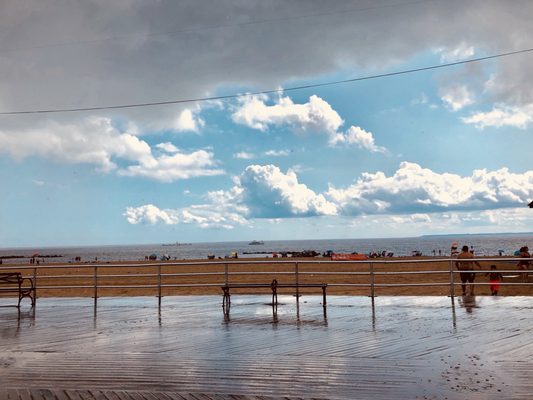 Coney Island (rainy) boardwalk with the clouds rollin' in