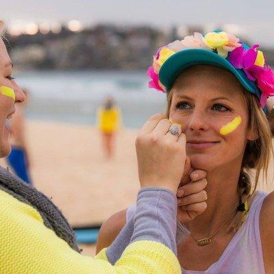 Happy bright yoga teacher.  Charity beach yoga for One Wave mental health awareness.
 
 Sunrise yoga at Bondi Beach, Australia