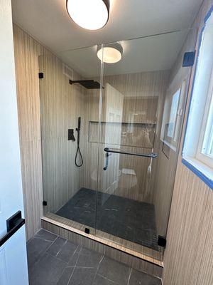 Custom Framless shower door with U clamp installation 
3/8 clear tempered glass