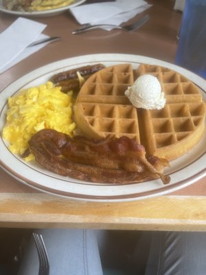 2 bacon, 2 eggs scrambled, 2 sausages, and a waffle