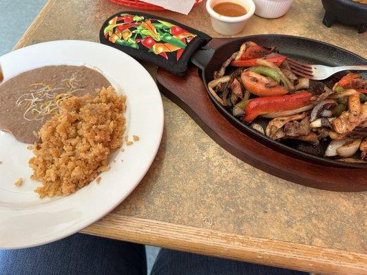 Beef & Chicken Fajitas w/ beans & rice.