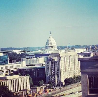 Beers and bbq on the roof (4 grills, 4 coolers, 360* views).  US capitol & Georgetown Law  in this photo.