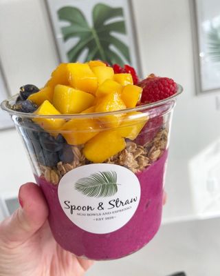 Pitaya (Dragon fruit) Bowl with Granola, raspberries, blueberries and Mango. Topped with hunny. So delicious!