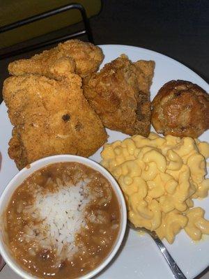 Dark Chicken 3 piece meal with a side of red beans and rice, Mac & Cheese, and a honey butter blueberry biscuit