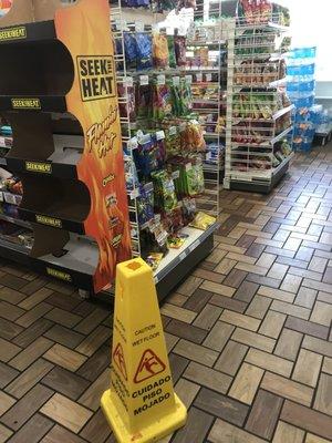 Floor is wet sign but no evidence of floor actually being clean. Floors were sticky.