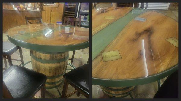 Custom wine barrel table with epoxy river and aged pecan wood