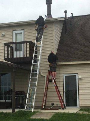 The crew hanging gutters