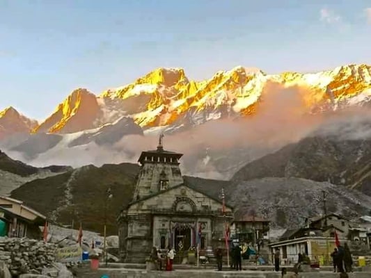 the splendid Kedarnath temple is enveloped by the imposing  snow draped Himalayas    The temple was constructed  in the 8th c...