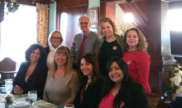 Dr. Mensink and the staff celebrate with a Christmas luncheon.