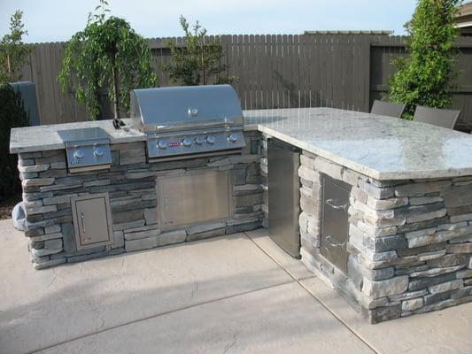 Extended BBQ island with granite counter top, new side burner and extra storage