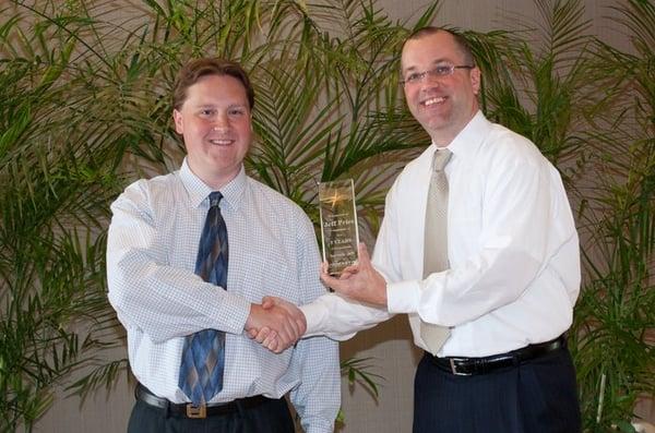 Rocket IT CEO Matt Hyatt congratulations CTO Jeff Pries for five years of outstanding service.