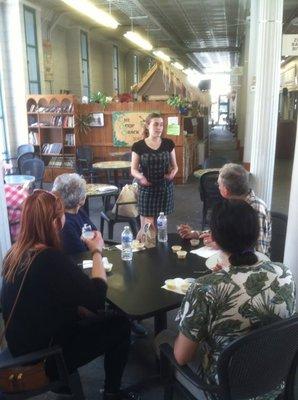 Amelia of the Soup Shack speaking to a group on a tour.