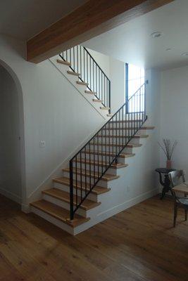 Modern Farmhouse white oak treads with metal rails.
 Jon Casey Const built and installed