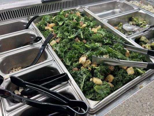 Kale and nuts and seeds on salad bar