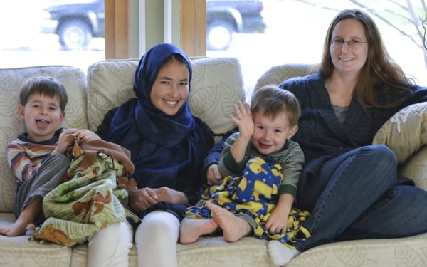 Dr. Elizabeth with her sons Darin, Everett, and her host student from Afghanistan, Qamar