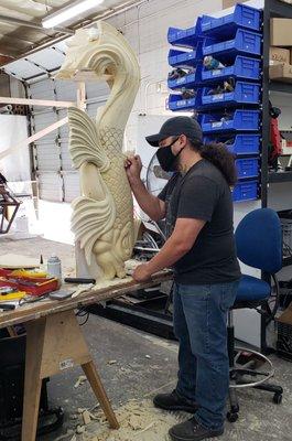 Sculpting a decorative fish for a full size fireplace at Kihl Studios