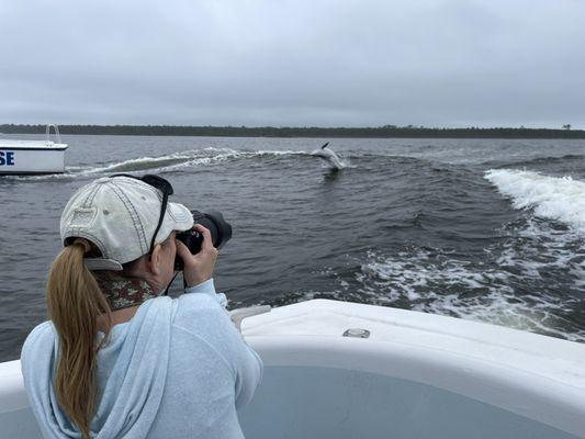 Me taking dolphins photos. You can see one jumping back there.