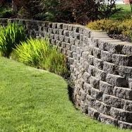 Retaining walls and drainage don't have to be ugly. Call us to design what you need to protect your home in such way that you will love it.