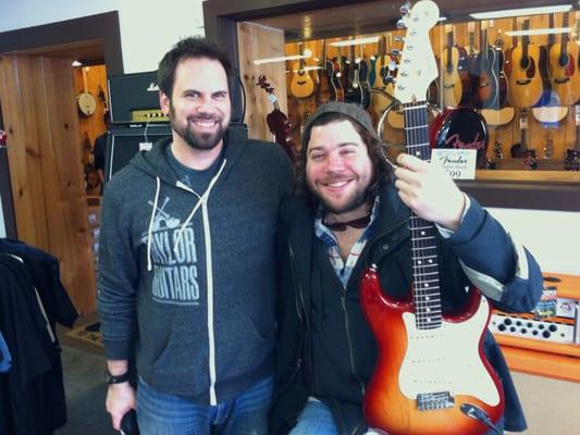 Gabriel gives Josh Krajcik a Fender Stratocaster.