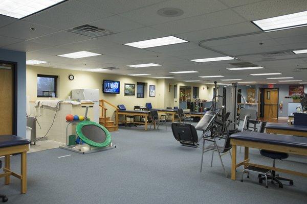 The large open treatment space inside the Shrewsbury location of Atlantic Physical Therapy Center.