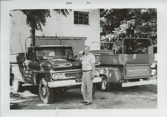 A B Parker in front of the shop 1964