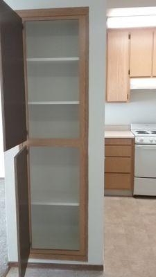 Storage by kitchen.