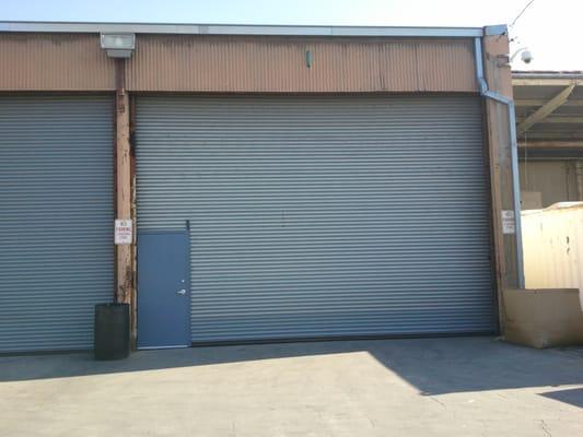 Heavy duty commercial roll up door with man door