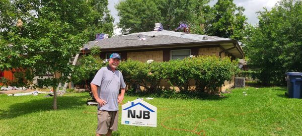 Doc helping out a Garland homeowner with a new roof.