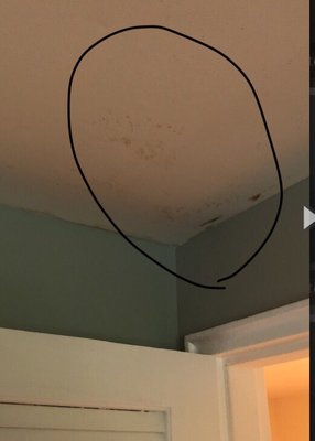 Water soaking through the ceiling as a result of no drain pan in the AC unit.