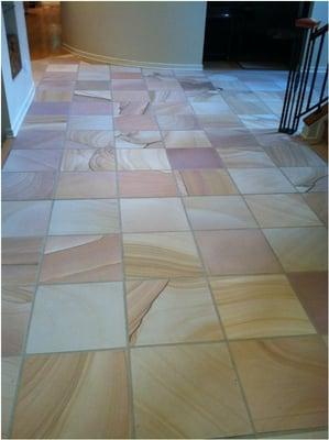 Honed finish to 20year old sandstone floor.