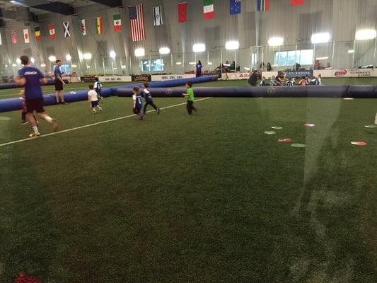 JJ playing with out the parental. Large indoor field.