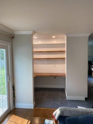 Kitchen niche turned into office space with shiplap and floating shelves