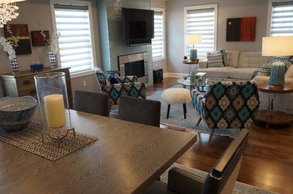 Eclectic mix living room with glass tile fireplace and custom upholstery