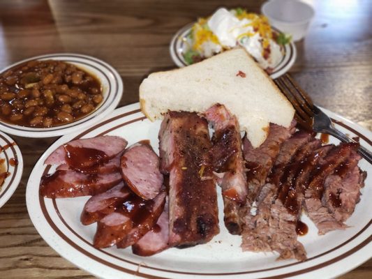 Decided to get the 3 plate combo because I wanted to try their sausage....it was ok but thr ribs and brisket are the bomb of deliciousness!