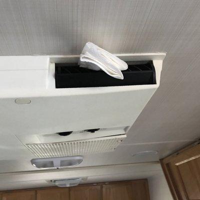 AC unit with a napkin to hold open the vents