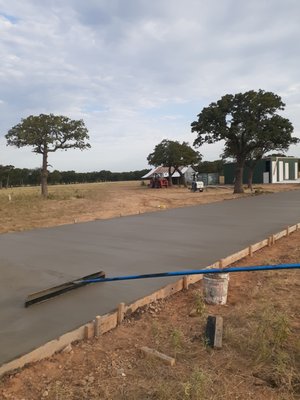 Finishing up a driveway.