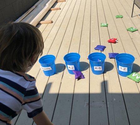 Learning alphabetical order, consonants and vowels, gross and fine motor skills, hand-eye coordination and having a blast!