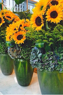 Sunflowers and blue hydrangeas with solidago