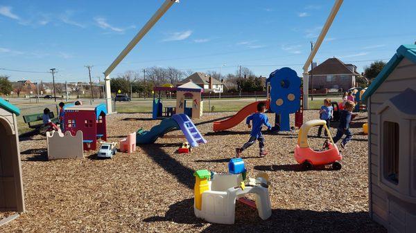 The children playing outside on a beautiful warm February morning.