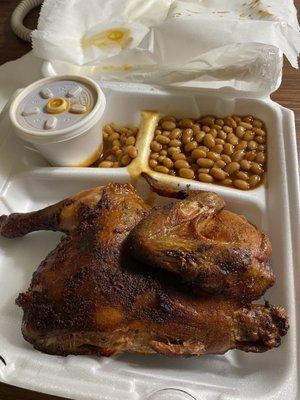 First look at the plate once I opened it. Half BBQ Chicken and my side of baked beans