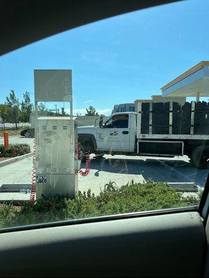 Worker parked at the gas station. Getting In N Out in a different parking lot