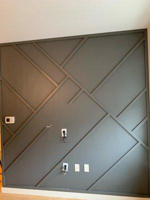 Wood paneling accent wall with fresh paint