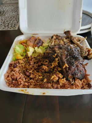 Lg. Jerk Chicken with rice and peas, plantains, salad