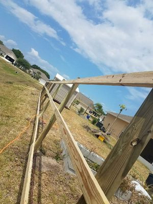 Wood fence being built