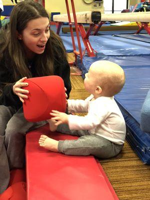 One of ouf awesome coaches during a Parent & Me class!  Everyone loves those blocks!!